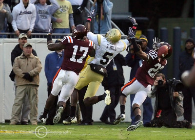 Jackets WR Stephen Hill is double teamed by Hokies FS Kam Chancellor and CB Stephan Virgil