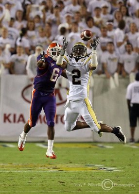 Yellow Jackets CB Mario Butler jumps in front of Tigers WR Jacoby Ford to intercept the pass