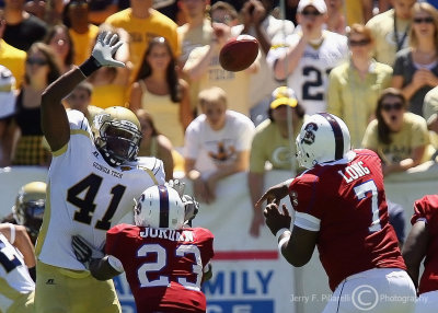 Jackets OLB Anthony Egbuniwe leaps to attempt to block a pass by Bulldogs QB Malcolm Long