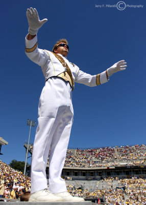 Georgia Tech Yellow Jackets conductor leads the band during halftime festivities