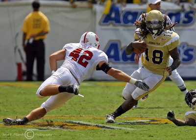 Jackets B-back Allen cuts to avoid diving Wolfpack LB Audie Cole