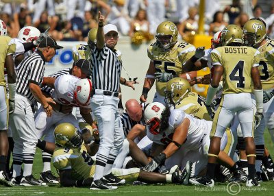 Georgia Tech offensive players struggle in vain to retrieve a fumble