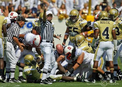 Georgia Tech offensive players struggle in vain to retrieve a fumble