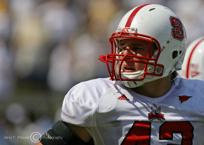 Wolfpack LB Cole checks the sidelines