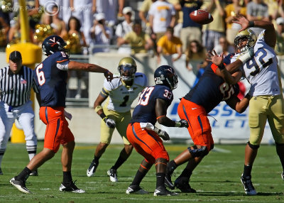 Yellow Jackets DE Jason Peters tries to block a pass from Cavaliers QB Verica