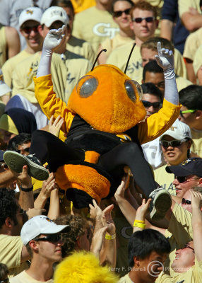 Jackets Mascot Buzz rides the fan wave in the north end zone