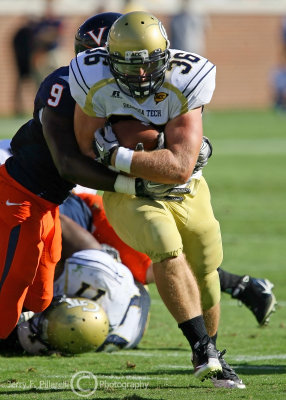 Tech RB Cox drags Cavaliers LB LaRoy Reynolds for extra yardage