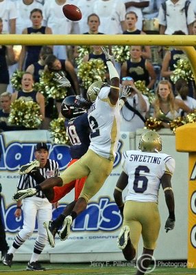 Yellow Jackets CB Butler defends the long pass to Cavaliers WR Kris Burd