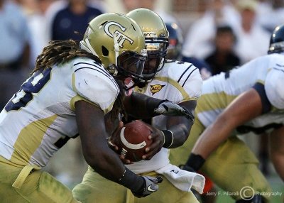 Yellow Jackets QB Nesbitt hands off to B-back Allen