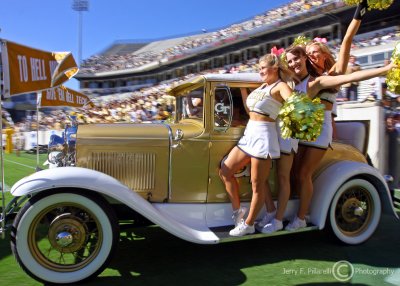 Yellow Jackets Cheerleaders ride the Ramblin Wreck into Bobby Dodd Stadium