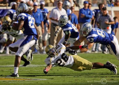 Jackets DB Dominique Reese dives to try to stop Blue Raiders RB D.D. Kyles
