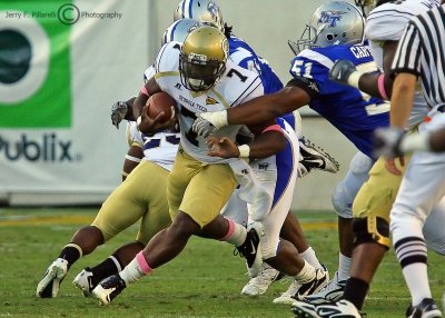 Jackets QB David Sims tries to outrun the Blue Raiders defensive line