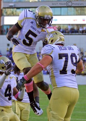 Yellow Jackets WR Stephen Hill celebrates a touchdown catch with C Sean Bedford