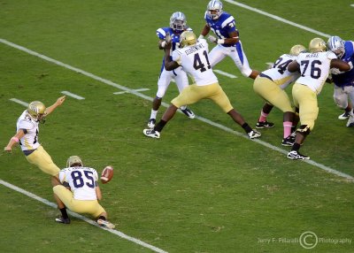 Yellow Jackets K Scott Blair kicks an extra point late in the game