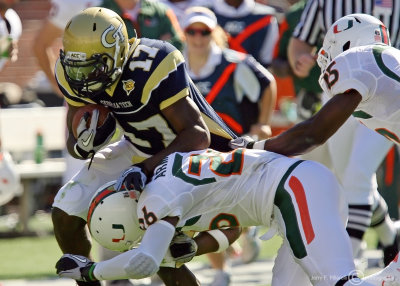 Georgia Tech A-back Smith fights off Miami DB Ray-Ray Armstrong