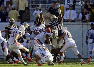 Georgia Tech DT TJ Barnes gets a hand up in an effort to block the PAT attempt by Miami PK Matt Bosher