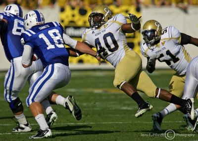 Yellow Jackets LB Julian Burnett lunges for Blue Devils QB Brandon Connette