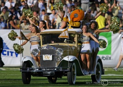 Georgia Tech Cheerleaders and Buzz ride the Ramblin Wreck onto the field before the second half kickoff