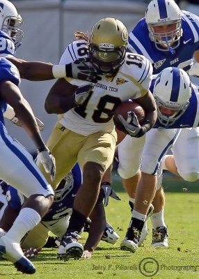 Jackets B-back Allen runs through the Blue Devils defense