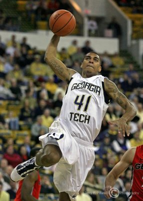Yellow Jackets G Glen Rice Jr. glides in for an uncontested jam