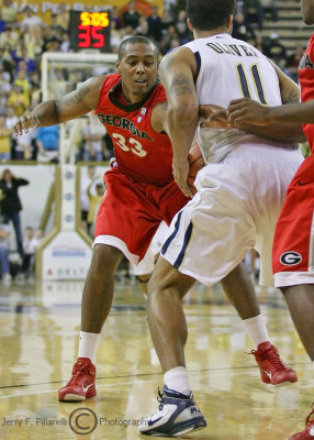 UGA F Thompkins reaches in to attempt a steal from GT F Oliver