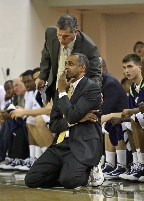Georgia Tech Yellow Jackets Head Coach Paul Hewitt confers with an assistant during the game