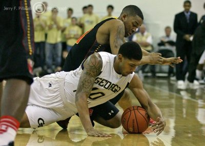 Yellow Jackets G Lance Storrs dives for a loose ball