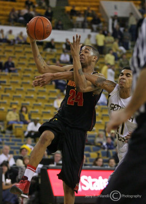 Jackets G Rice draws an intentional foul while attempting to stop the breakaway by Terrapins G Cliff Tucker