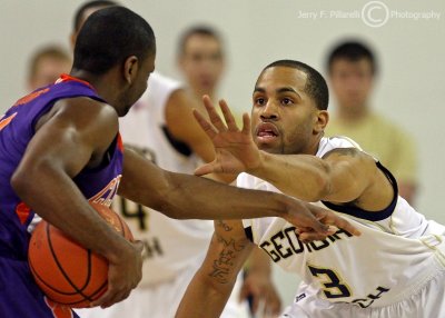 Yellow Jackets G Miller squares up on a Tigers ball handler