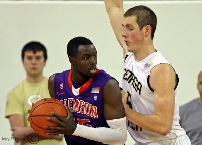 Tech C Miller leans on Tigers F Jerai Grant under the basket