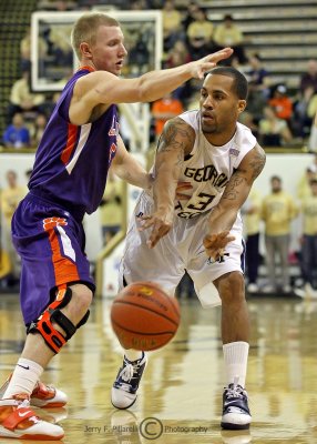 Georgia Tech G Miller passes around Clemson G Smith
