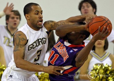 Jackets G Miller goes for the steal from Tigers G Young…