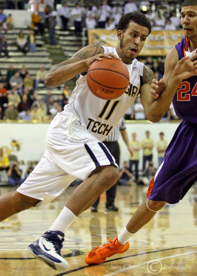 Georgia Tech F Oliver drives past Clemson F Jennings on his way to the basket