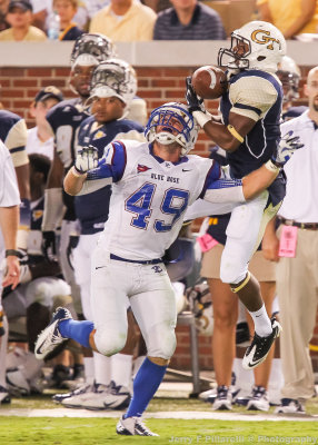 Tech WR Tony Zenon pulls in a pass over Presbyterian S J.J. Russell