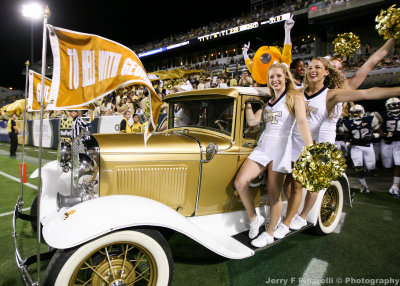 Yellow Jackets Cheerleaders ride the Wramblin Wreck onto the field before the beginning of the third quarter