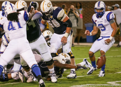 Jackets QB Synjyn Days reaches for his fumble at the goal line