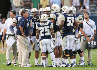 Georgia Tech Head Coach Paul Johnson addresses his team during a time out