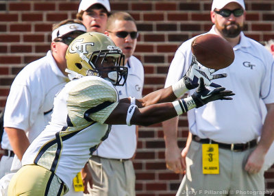 Yellow Jackets A-back Tony Zenon catches a pass out of the backfield for a first down