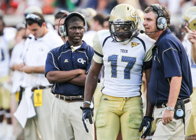 Georgia Tech Head Coach Paul Johnson gives instructions to A-back Orwin Smith