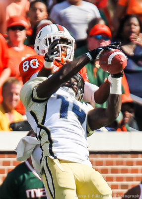 Tech DB Jemea Thomas pulls down the interception in front of Miami WR Rashawn Scott