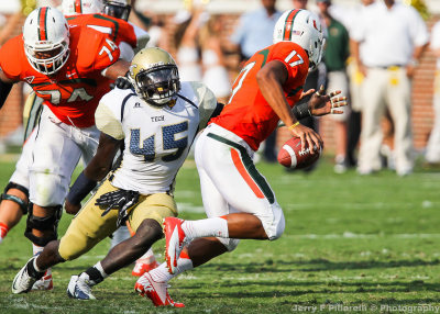 Jackets LB Attaochu chases Canes QB Stephen Morris out of the pocket