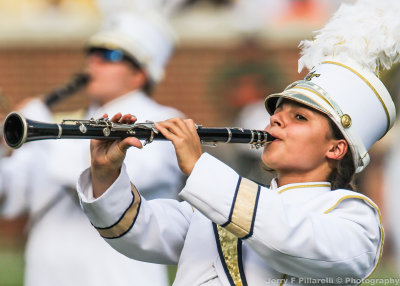 Yellow Jackets Band member plays during the halftime festivities