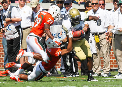 Jackets A-back Smith breaks out of the tackle of Canes DB Rodgers