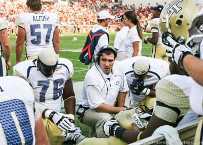 GT OL huddles on the sidelines during the game