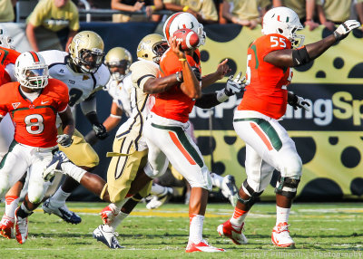 Jackets defender gets to Canes QB Morris in the backfield