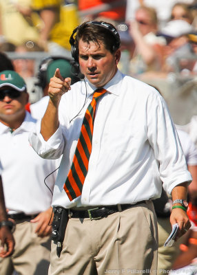 Miami Hurricanes Head Coach Al Golden talks to his players on the field