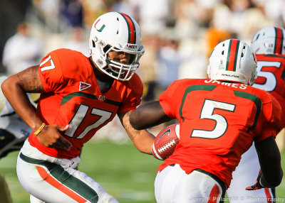 Miami QB Morris hands off to RB James