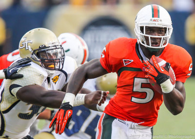 Miami RB James breaks through the Georgia Tech defense for a touchdown in overtime