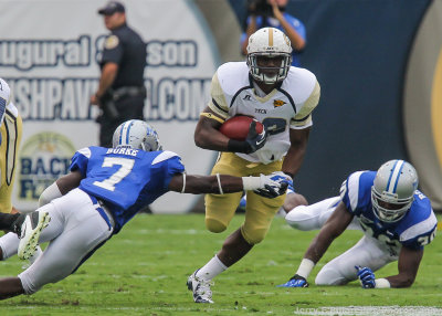 Georgia Tech RB Broderick Snoddy runs through the arm tackle of Middle Tennessee State CB Khari Burke