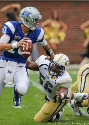 Tech DE Anthony Williams lunges for Blue Raiders QB Kilgore